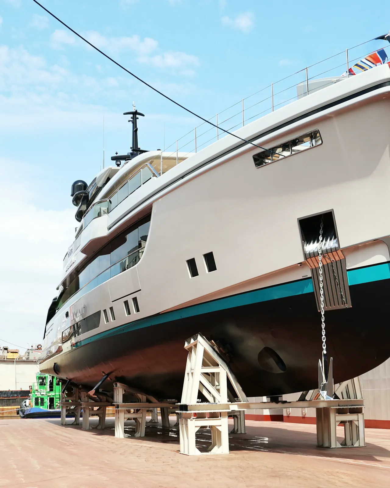 A newly built yacht on cradles in a shipyard floating dock